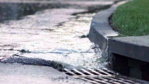 Image showing water flowing into Council stormwater drain